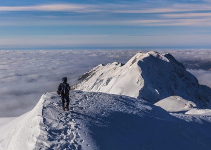 climbing on mountain in winter. Piatra Craiului Mountains, Romania